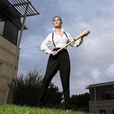 simsearch:614-08875291,k - Businesswoman holding a baseball bat Photographie de stock - Premium Libres de Droits, Code: 614-08865498