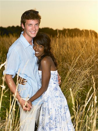 simsearch:614-08866253,k - Couple at sunset,  in a field Stock Photo - Premium Royalty-Free, Code: 614-08865733