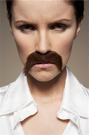 Portrait of woman wearing moustache Stock Photo - Premium Royalty-Free, Code: 614-08865776