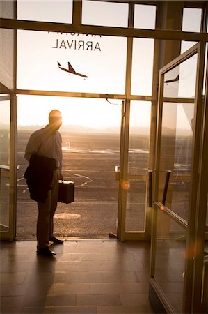 people airports silhouettes - Man arriving at small airport Stock Photo - Premium Royalty-Free, Code: 614-08865856
