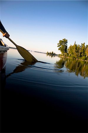 simsearch:614-06720064,k - Canoe paddle dipped in tranquil lake Stock Photo - Premium Royalty-Free, Code: 614-08865889