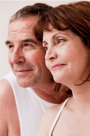 Eldery couple heads together smiling Stock Photo - Premium Royalty-Free, Code: 614-08866078