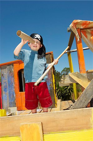 person with telescope - Young boy playing pirates Stock Photo - Premium Royalty-Free, Code: 614-08866128