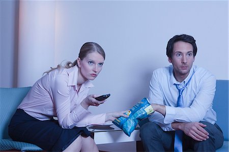 couple in hotel room, watching TV Stock Photo - Premium Royalty-Free, Code: 614-08866193