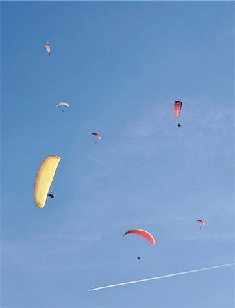 simsearch:640-01365435,k - Paragliding in blue skies Stock Photo - Premium Royalty-Free, Code: 614-08866274