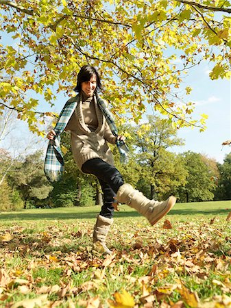 simsearch:614-08867065,k - Woman having fun kicking Autumn leaves Stock Photo - Premium Royalty-Free, Code: 614-08866335