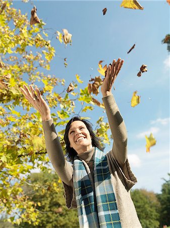 simsearch:649-07560359,k - Woman with Autumn leaves in the air Stock Photo - Premium Royalty-Free, Code: 614-08866338