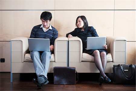 simsearch:6111-06727306,k - Man,woman working while waiting Stock Photo - Premium Royalty-Free, Code: 614-08866444