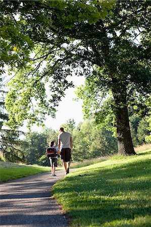 friends sidewalk walk - Father And Son Walking In Park Stock Photo - Premium Royalty-Free, Code: 614-08866749