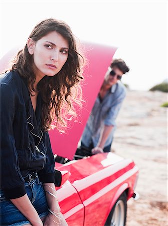 couple standing at car with opened hood Stock Photo - Premium Royalty-Free, Code: 614-08866797