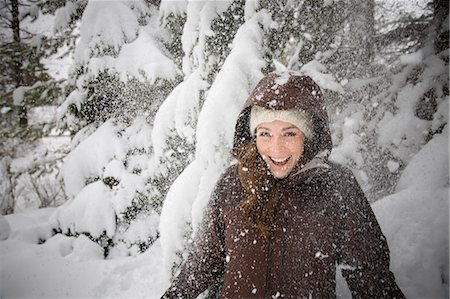 Woman laughing in snow Stock Photo - Premium Royalty-Free, Code: 614-08866920