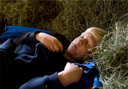 simsearch:632-05553588,k - boy sleeping in hay barn Stock Photo - Premium Royalty-Free, Code: 614-08867120