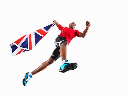 simsearch:614-08867399,k - Male athlete running with union jack Foto de stock - Sin royalties Premium, Código: 614-08867411