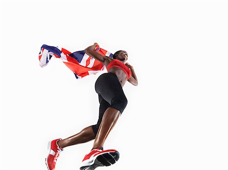 simsearch:695-05770082,k - Female athlete running with union jack Fotografie stock - Premium Royalty-Free, Codice: 614-08867412