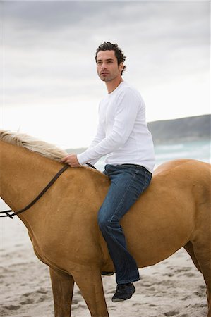 simsearch:6122-07706910,k - Man riding horse on the beach Foto de stock - Sin royalties Premium, Código: 614-08867451