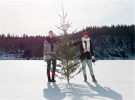 simsearch:614-08866253,k - Couple with christmas tree Stock Photo - Premium Royalty-Free, Code: 614-08867574