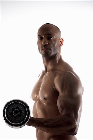 simsearch:649-09205884,k - Bare chested man lifting weights Foto de stock - Sin royalties Premium, Código: 614-08867736