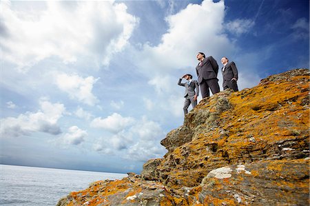 simsearch:6113-09058889,k - Businessmen standing on cliff edge Stock Photo - Premium Royalty-Free, Code: 614-08867819