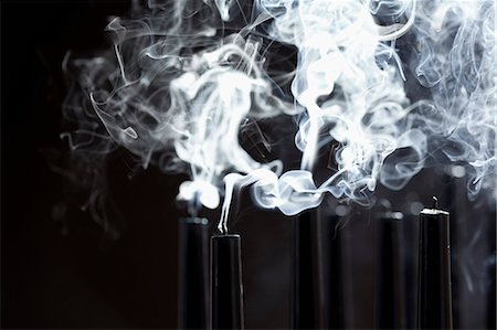 simsearch:614-08869716,k - Close up of smoking black candles Stock Photo - Premium Royalty-Free, Code: 614-08867856