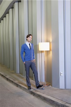 european light switch - Businessman with lamp in empty hallway Stock Photo - Premium Royalty-Free, Code: 614-08867862