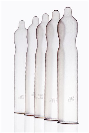 Inflated condoms standing in row Stock Photo - Premium Royalty-Free, Code: 614-08867871