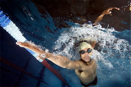 simsearch:6124-08945923,k - Swimmer doing front crawl in pool Photographie de stock - Premium Libres de Droits, Code: 614-08867953