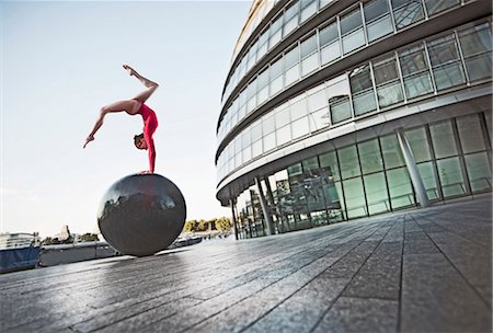 simsearch:632-05816612,k - Gymnast balancing on ball sculpture Stock Photo - Premium Royalty-Free, Code: 614-08867973