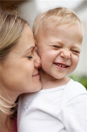 simsearch:695-03375963,k - Mother kissing toddler boy outdoors Stock Photo - Premium Royalty-Free, Code: 614-08867994