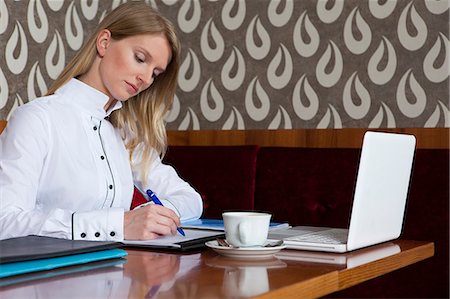 simsearch:649-06352545,k - Woman studying with laptop in cafe Stock Photo - Premium Royalty-Free, Code: 614-08868080