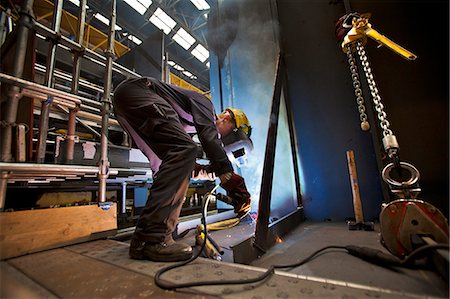 simsearch:649-05820711,k - Welder at work in shipyard Photographie de stock - Premium Libres de Droits, Code: 614-08868459