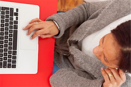 Businesswoman working on laptop Stock Photo - Premium Royalty-Free, Code: 614-08868733