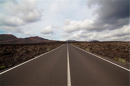 Paved road in rural landscape Stock Photo - Premium Royalty-Free, Code: 614-08868753