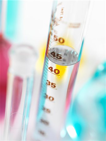 Close up of water in graduated cylinder Stock Photo - Premium Royalty-Free, Code: 614-08868772