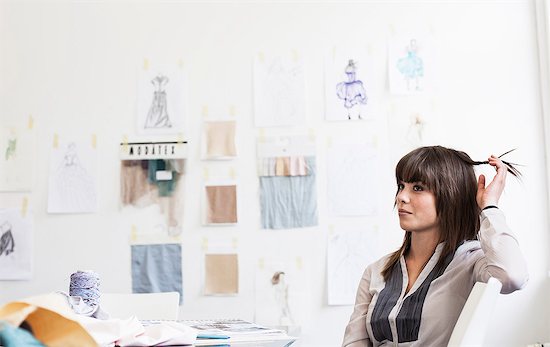 Businesswoman sitting in office Stock Photo - Premium Royalty-Free, Image code: 614-08869122