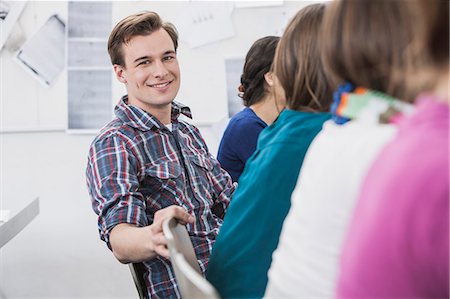 simsearch:614-08866586,k - Student smiling in class Stock Photo - Premium Royalty-Free, Code: 614-08869154