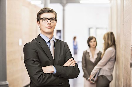 simsearch:614-08866586,k - Businessman standing in hallway Stock Photo - Premium Royalty-Free, Code: 614-08869358