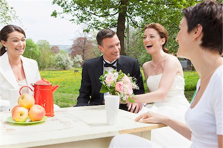 simsearch:649-08543866,k - Newlywed couple at table with friends Stock Photo - Premium Royalty-Free, Code: 614-08869408