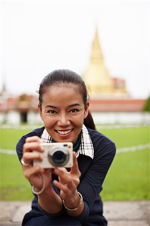 simsearch:614-06895809,k - Woman taking pictures at ornate temple Stock Photo - Premium Royalty-Free, Code: 614-08869639