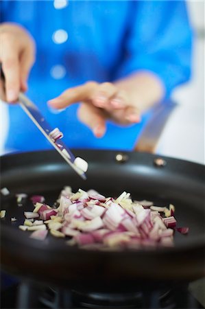 simsearch:614-08885076,k - Close up of woman frying onions Stock Photo - Premium Royalty-Free, Code: 614-08869799