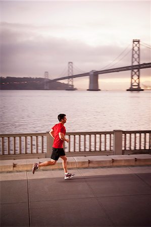 embarcadero san francisco - Man running on city street Stock Photo - Premium Royalty-Free, Code: 614-08869997