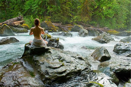 simsearch:614-06002599,k - Partially clothed woman meditating on rock by water Foto de stock - Sin royalties Premium, Código: 614-08874095