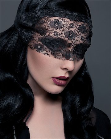 simsearch:614-08874246,k - Portrait of young woman with black lace covering eyes Stockbilder - Premium RF Lizenzfrei, Bildnummer: 614-08874246