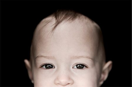 simsearch:614-06442350,k - Close up on face of female toddler Stockbilder - Premium RF Lizenzfrei, Bildnummer: 614-08874267