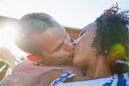 simsearch:614-06402816,k - Young couple kissing on balcony, close up Foto de stock - Sin royalties Premium, Código: 614-08875219