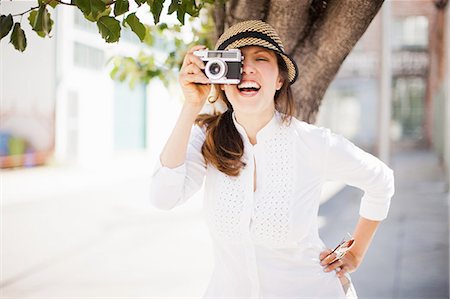 simsearch:614-06895809,k - Mid adult woman using vintage camera, smiling Stock Photo - Premium Royalty-Free, Code: 614-08875312