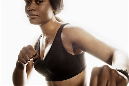 simsearch:614-08877634,k - Close up of woman in boxing pose Foto de stock - Royalty Free Premium, Número: 614-08875609