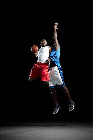 défenseur - Male basketball players jumping Photographie de stock - Premium Libres de Droits, Code: 614-08875669