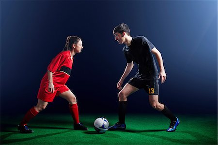 pony tail - Male and female soccer players with ball Foto de stock - Sin royalties Premium, Código: 614-08875698