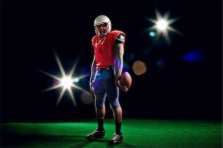 simsearch:6109-08389992,k - American football player with ball Stock Photo - Premium Royalty-Free, Code: 614-08875727