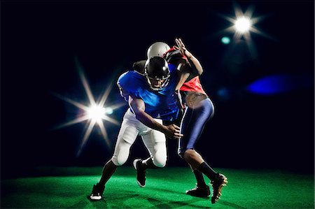 simsearch:614-08868397,k - Two american footballers playing Stock Photo - Premium Royalty-Free, Code: 614-08875720